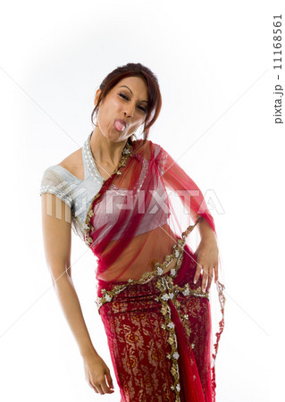 Young Indian woman sticking out her tongue Young Indian woman sticking out her tongue 11168561