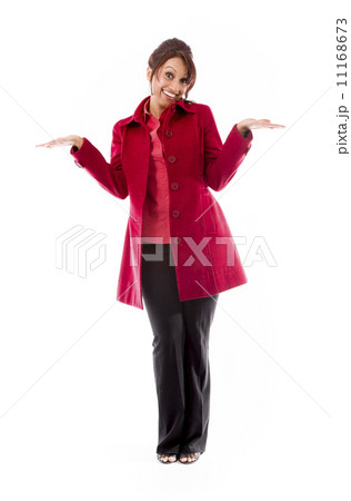 Indian young woman showing product with open hand palm 11168673