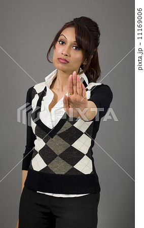 Indian businesswoman making stop gesture and showing stop Indian businesswoman making stop gesture and showing stop 11169006