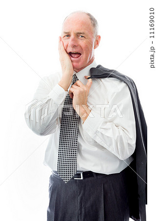 Businessman day dreaming with hand on cheek 11169010