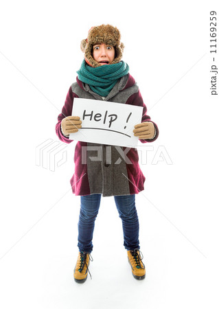 Young woman in warm clothing and showing help sign on white back Young woman in warm clothing and showing help sign on white back 11169259