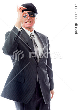 Businessman wearing eye mask and looking through finger's hole 11169417