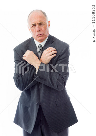 Businessman shivering in the cold isolated on white background Businessman shivering in the cold isolated on white background 11169553
