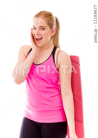 Young woman carrying exercising mat and looking excited 11169677