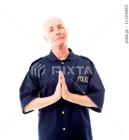 Policeman greeting with his hands clasped 11169803