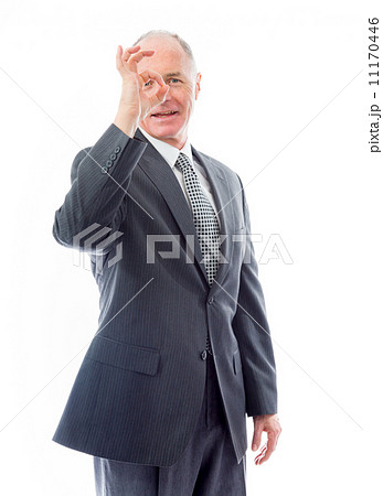 Businessman looking through finger's hole Businessman looking through finger's hole 11170446