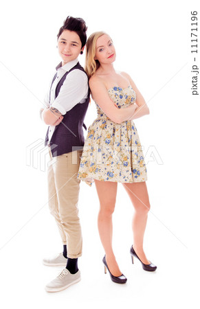 Lesbian couple standing with back to back with their arms crosse Lesbian couple standing with back to back with their arms crosse 11171196
