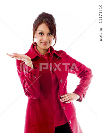 Indian young woman showing product with open hand palm 11171210