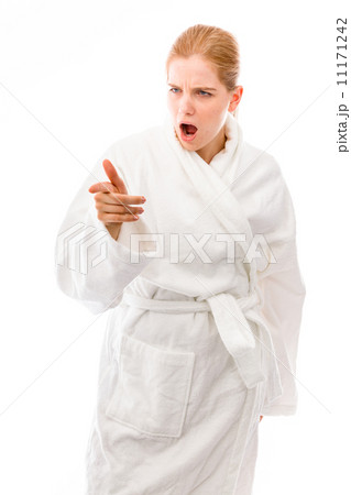 Young woman standing in bathrobe looking anger and pointing 11171242