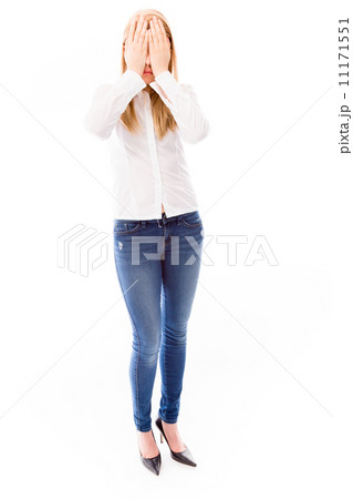 Young woman covering her face with her hands 11171551