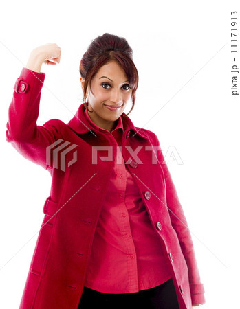 Indian young woman showing off her muscle Indian young woman showing off her muscle 11171913