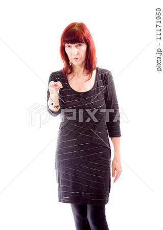 Mature woman pointing towards camera Mature woman pointing towards camera 11171969
