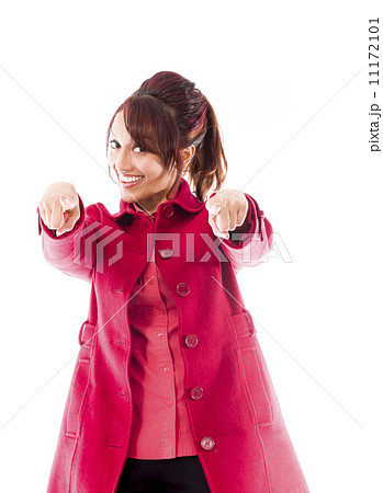Smiling Indian young woman pointing towards camera from both hands 11172101