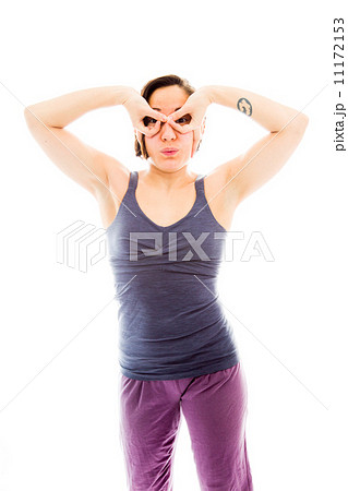 Young woman with her hands around her eyes Young woman with her hands around her eyes 11172153