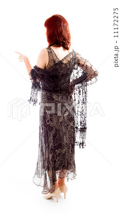 Rear view of a mature woman pointing 11172275
