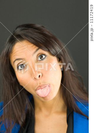 Portrait of a young businesswoman sticking out her tongue Portrait of a young businesswoman sticking out her tongue 11172419
