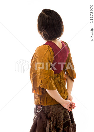 Rear view of a young woman thinking with her hands behind back 11172970