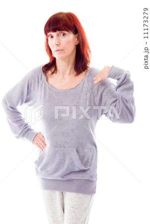 Mature woman standing with her hand on hip Mature woman standing with her hand on hip 11173279