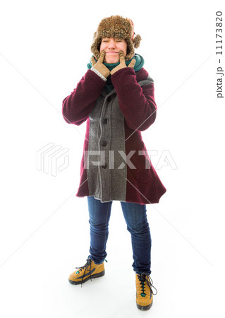 Young woman in warm clothing and showing smiley face Young woman in warm clothing and showing smiley face 11173820