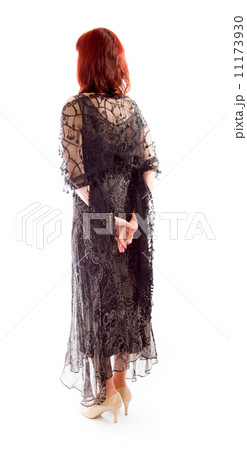 Rear view of a mature woman thinking with her hands behind back Rear view of a mature woman thinking with her hands behind back 11173930