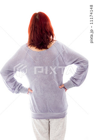 Rear view of a mature woman standing with her arms akimbo 11174148