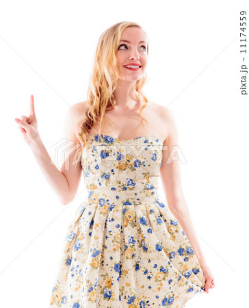 Beautiful young woman pointing upward Beautiful young woman pointing upward 11174559