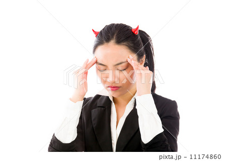 Devil side of a young Asian businesswoman suffering with headache isolated on white background Devil side of a young Asian businesswoman suffering with headache isolated on white background 11174860
