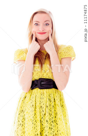 Beautiful young woman standing and showing smiley face 11174875