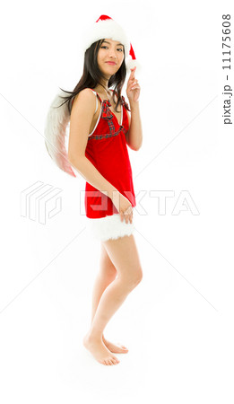 Asian young woman wearing Santa costume dressed up as an angel showing her fingers crossed Asian young woman wearing Santa costume dressed up as an angel showing her fingers crossed 11175608
