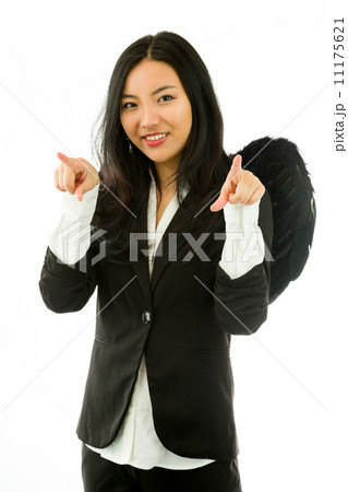 Asian young businesswoman dressed up as black angel pointing at you from both hands isolated on white background 11175621