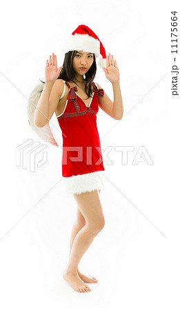 Asian young woman wearing Santa costume dressed up as an angel with making stop gesture sign from both hands Asian young woman wearing Santa costume dressed up as an angel with making stop gesture sign from both hands 11175664
