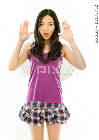 Asian young woman dressed up as an angel with making stop gesture sign from both hands 11175762