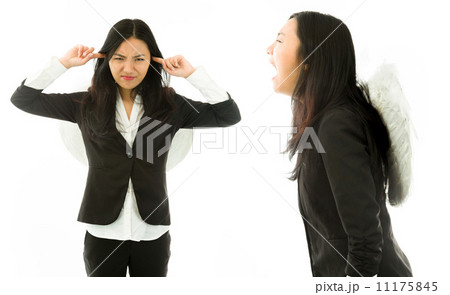 Asian young businesswoman dressed as angel shouting on another isolated on white background Asian young businesswoman dressed as angel shouting on another isolated on white background 11175845