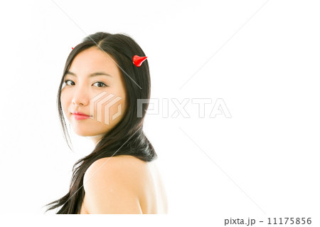 Devil side of a young naked Asian woman smiling 11175856