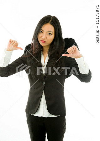 Disappointed Asian young businesswoman dressed up as black angel Disappointed Asian young businesswoman dressed up as black angel 11175971