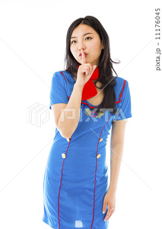 Asian air stewardess with finger on lips looking up 11176045