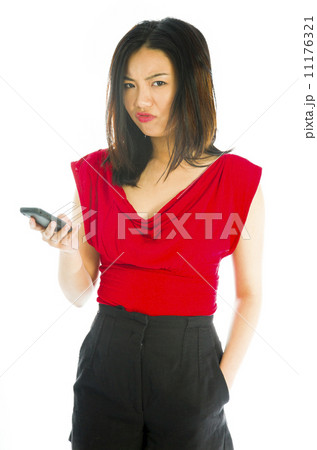 Young woman text messaging on mobile phone 11176321