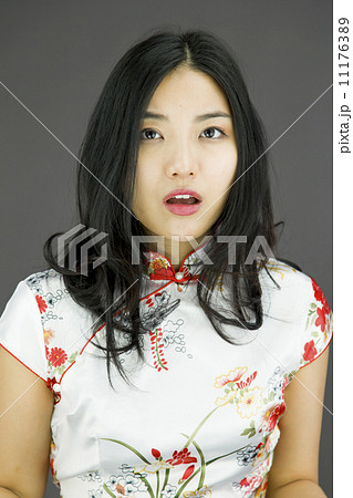 Shocked Asian woman with isolated on colored background 11176389