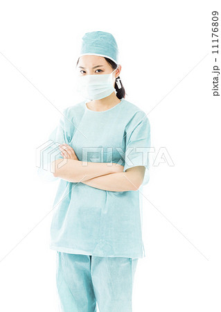 Confident Asian female surgeon standing with arms crossed 11176809