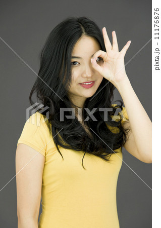 Young Asian woman showing OK sign Young Asian woman showing OK sign 11176876