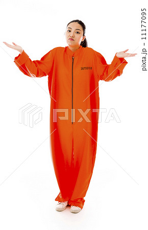 Young Asian woman shrugging in prisoners uniform 11177095