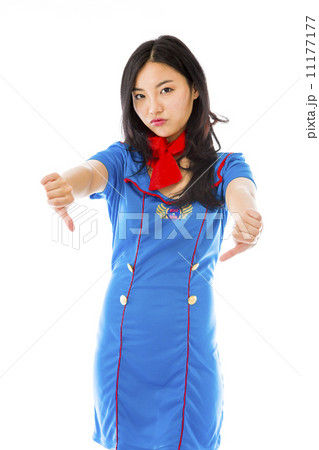 Unhappy Asian air stewardess giving thumbs down gesture 11177177