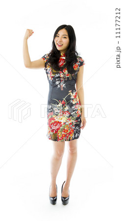 Asian young woman flexing biceps Asian young woman flexing biceps 11177212