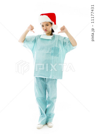 Unhappy Asian female surgeon giving thumbs down gesture 11177431