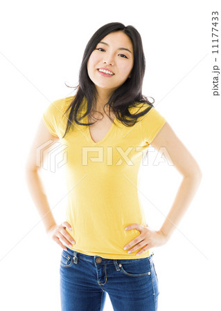 Young Asian woman standing with her arms akimbo 11177433