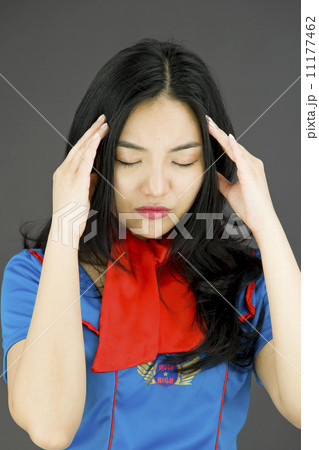 Asian air stewardess suffering from headache 11177462