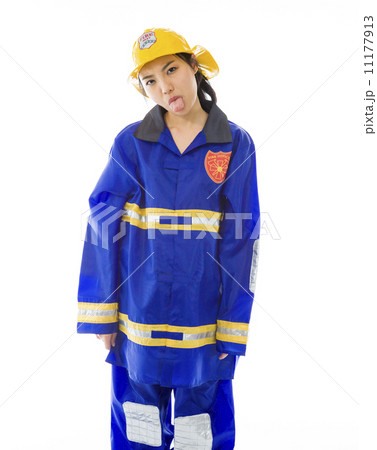 Lady firefighter poking out tongue towards camera isolated on white background Lady firefighter poking out tongue towards camera isolated on white background 11177913