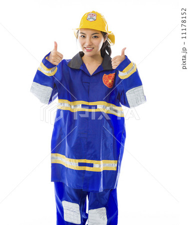 Lady firefighter showing thumbs up from both hands isolated on white background 11178152
