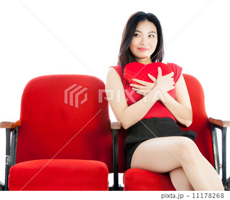 Attractive Asian girl 20s at the theatre isolate white backgroun 11178268
