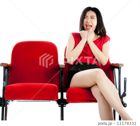 Attractive Asian girl 20s at the theatre isolate white backgroun 11178332